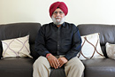 A portrait of a Sikh man at home