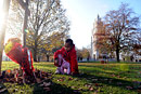 A young girl lays flowers at a remembrance service