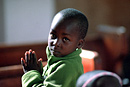 A boy saying prayers