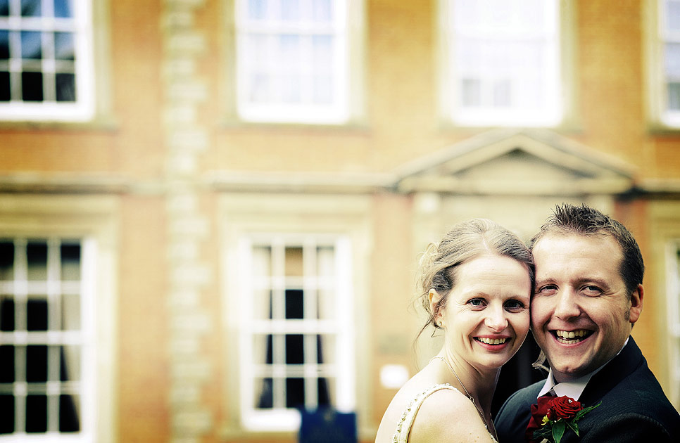 Bride and grrom in front of Ansty Hall